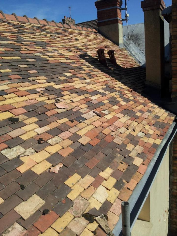 Des spécialistes en entretien de couverture se déplaçant à Dourdan